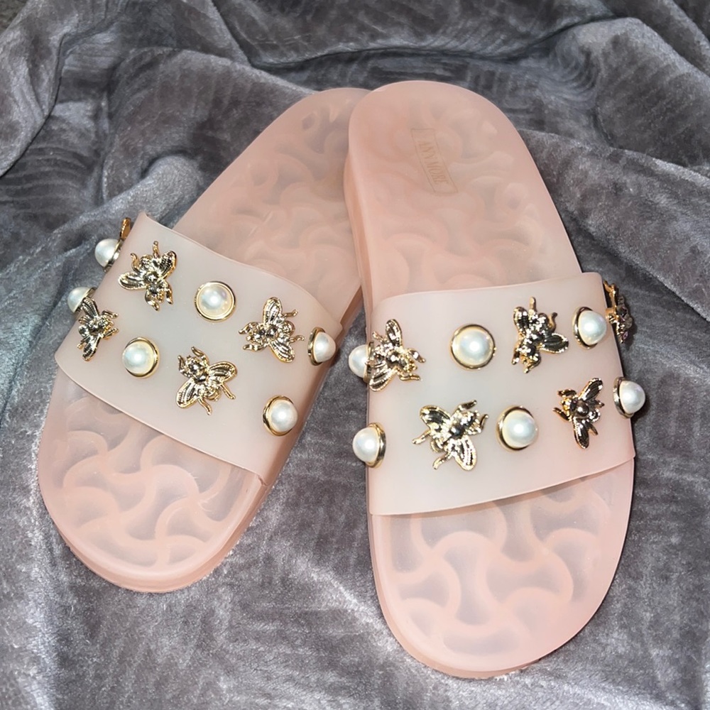 Baby pink slides with Pearl studs and gold bees.